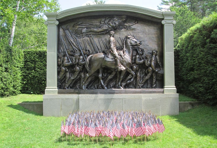 Sculpture at Saint-Gaudens National Historical Site, with flowers and greenery