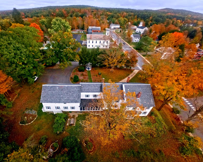 Aerial view of the Bridges Inn surrounded by fall colors