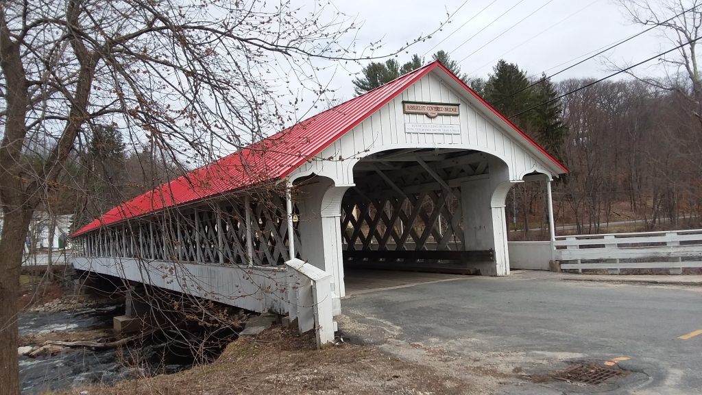 Covered bridge with red roof